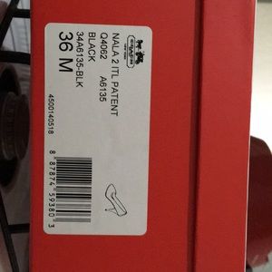 Coach black patent pumps